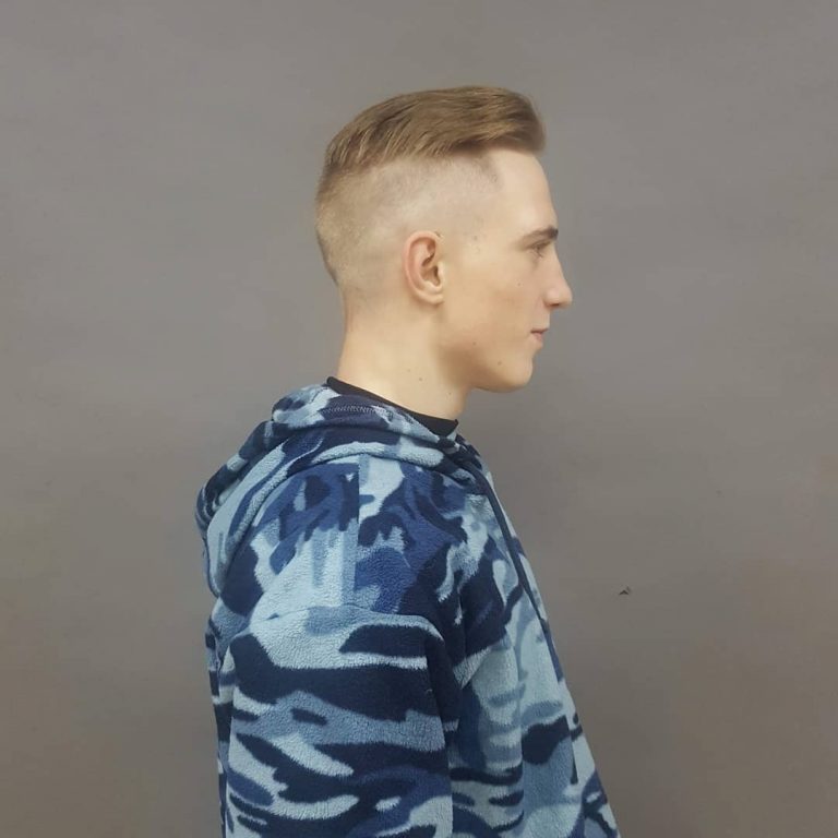 Disconnected undercut with swept-back top and high fade — side profile