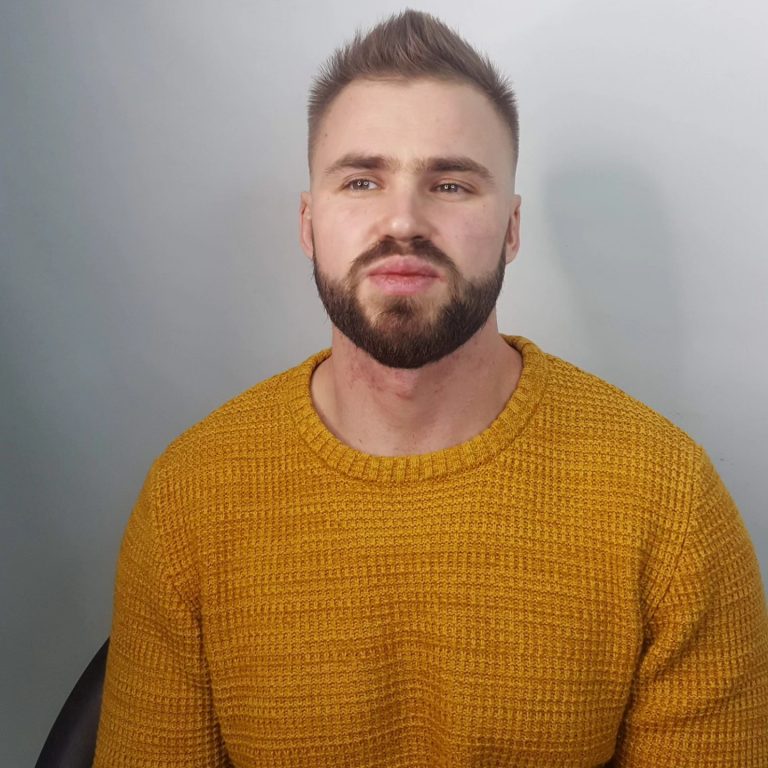 Short men's cut with a full, shaped beard — front view