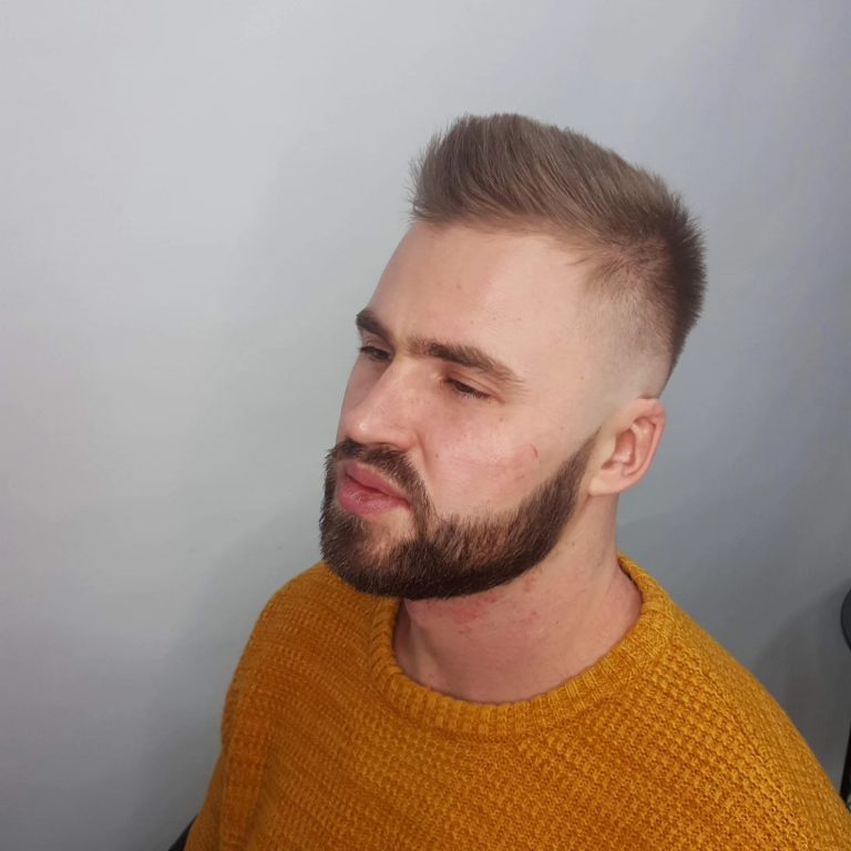 Men's short textured top with a trimmed beard — side view