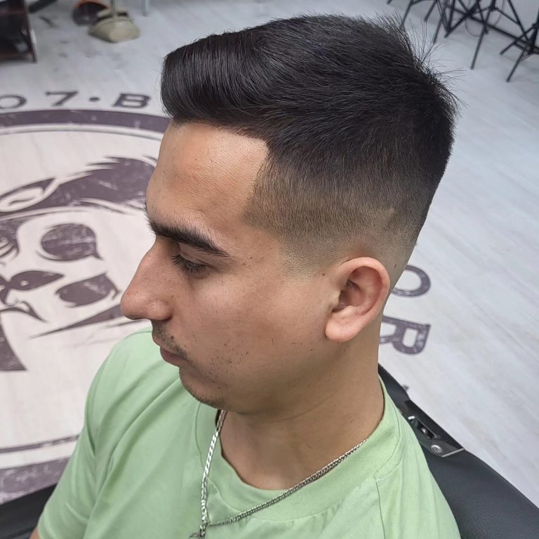 Short textured men's cut with a mid fade — side view