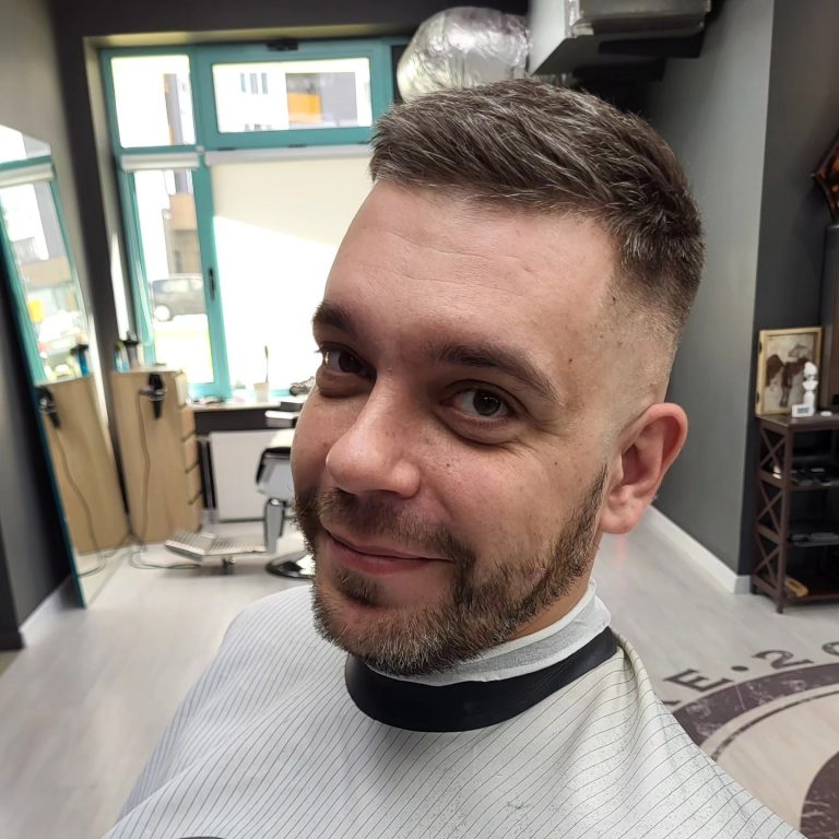 Short men's cut with a fade and full beard — front view