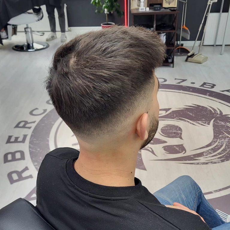 Men's swept-up top with a tapered back — rear view